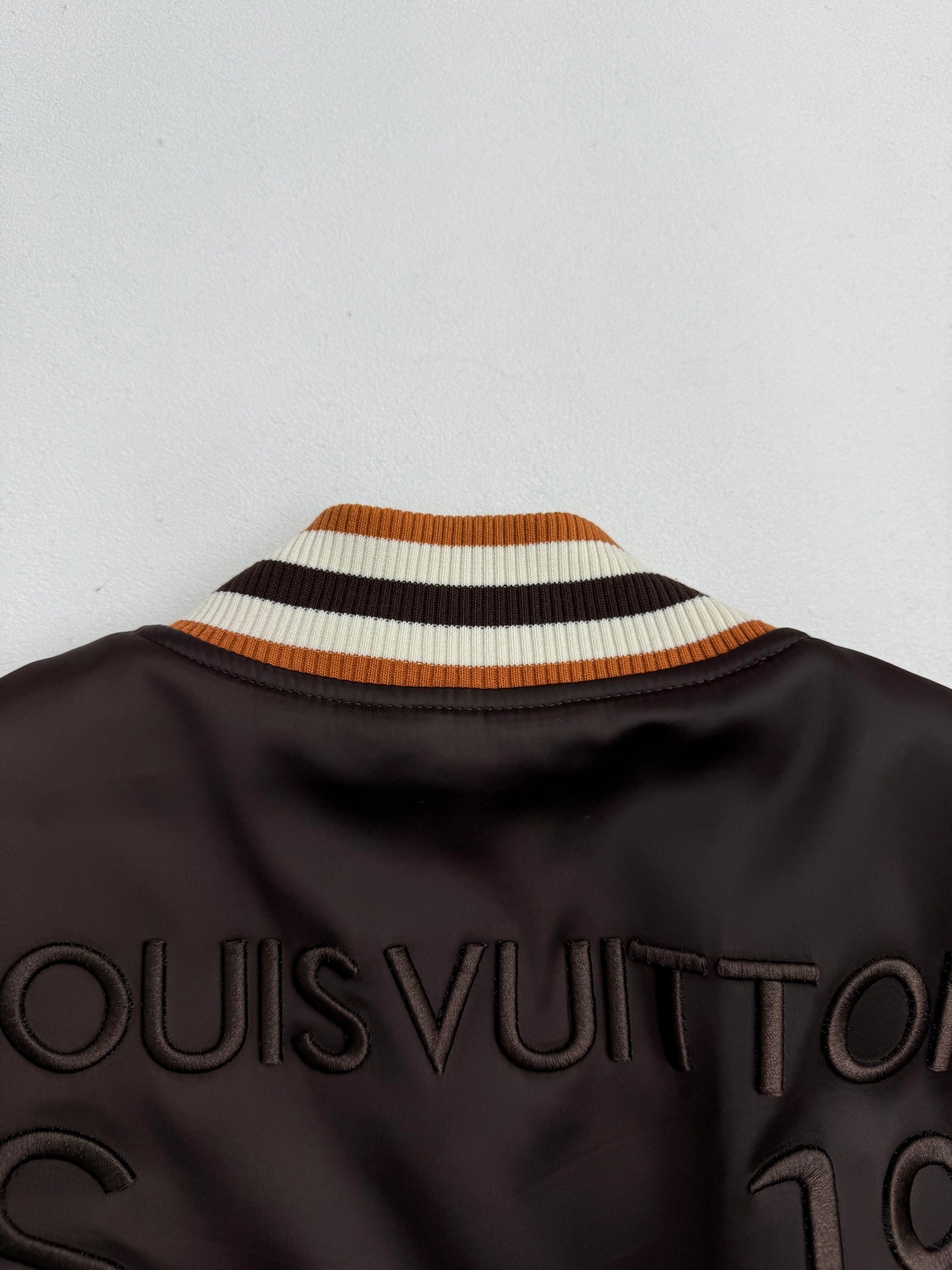 Bomber jacket with striped ribbed stand collar and “LOUISVUITTON” lettering