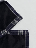 Plaid shirt-jacket shoulder and placket with snap buttons, navy and white checks