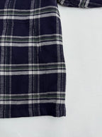 Plaid shirt-jacket side panel with vertical seams, navy and white check print