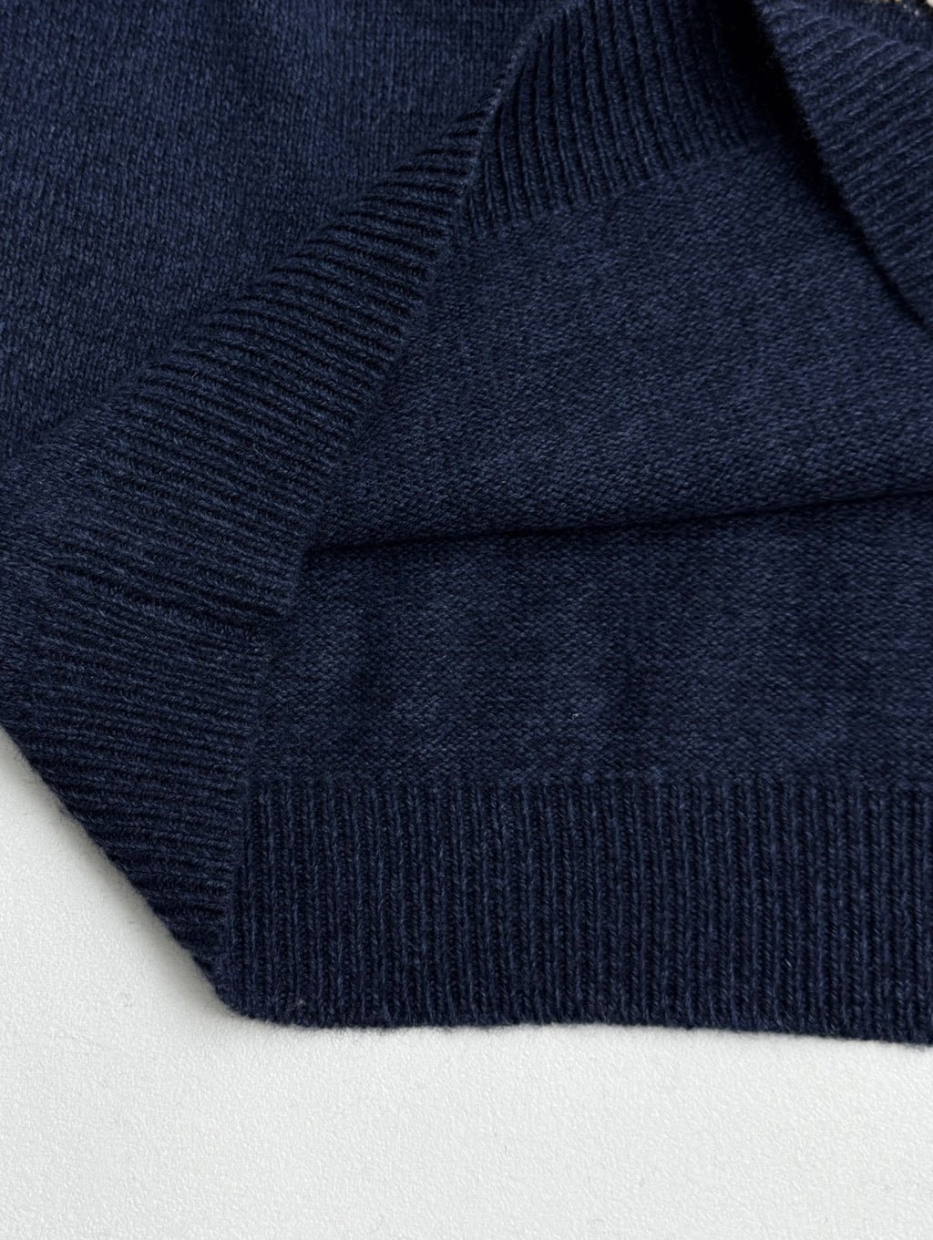 Navy knit sweater knit texture with ribbed trim detail