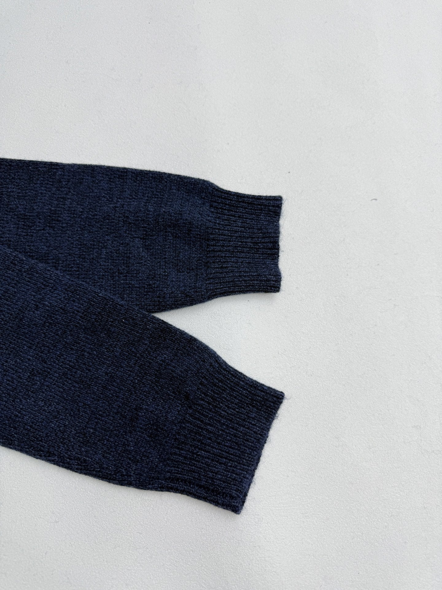 Navy knit sweater ribbed cuffs and long sleeve hem