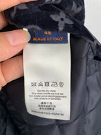 Fabric care label inside navy quilted jacket, Made in Italy