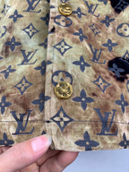 Louis Vuitton long jacket seam detail, tan-gold monogram fabric with navy emblem