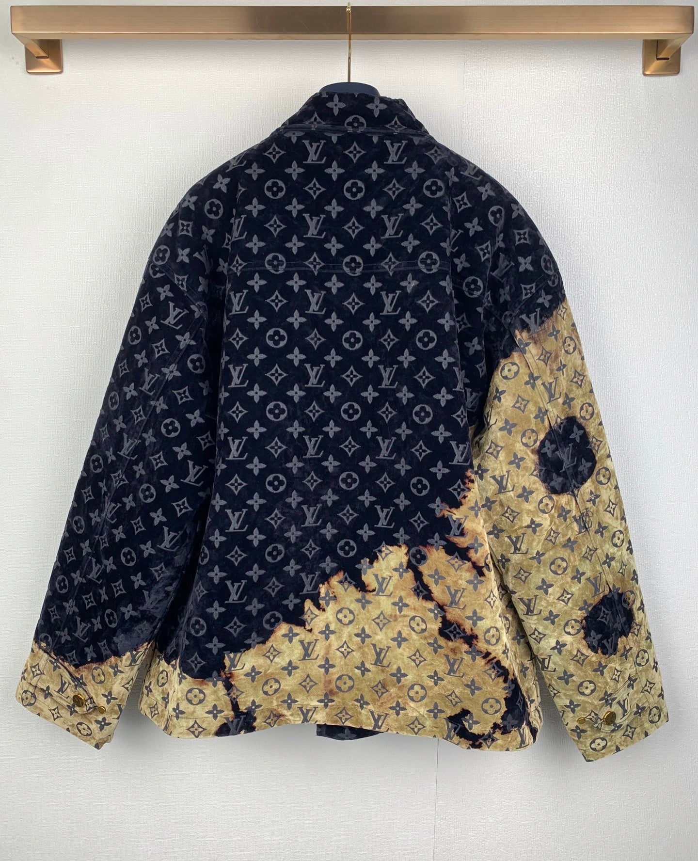 Louis Vuitton long jacket back view, dark navy monogram with gold patch overlay