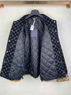 Quilted long jacket on hanger with dark monogram outer and padded lining