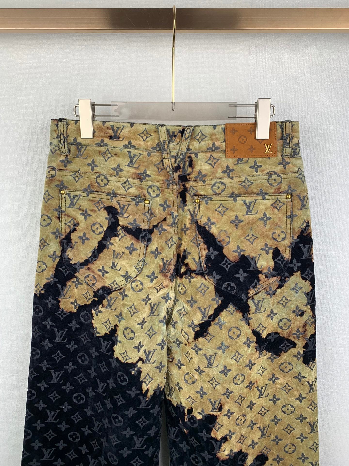 Louis Vuitton monogram long pants, front view in tan and dark blue patterned panels