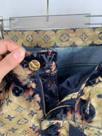 Louis Vuitton monogram jeans front detail with gold button and zipper
