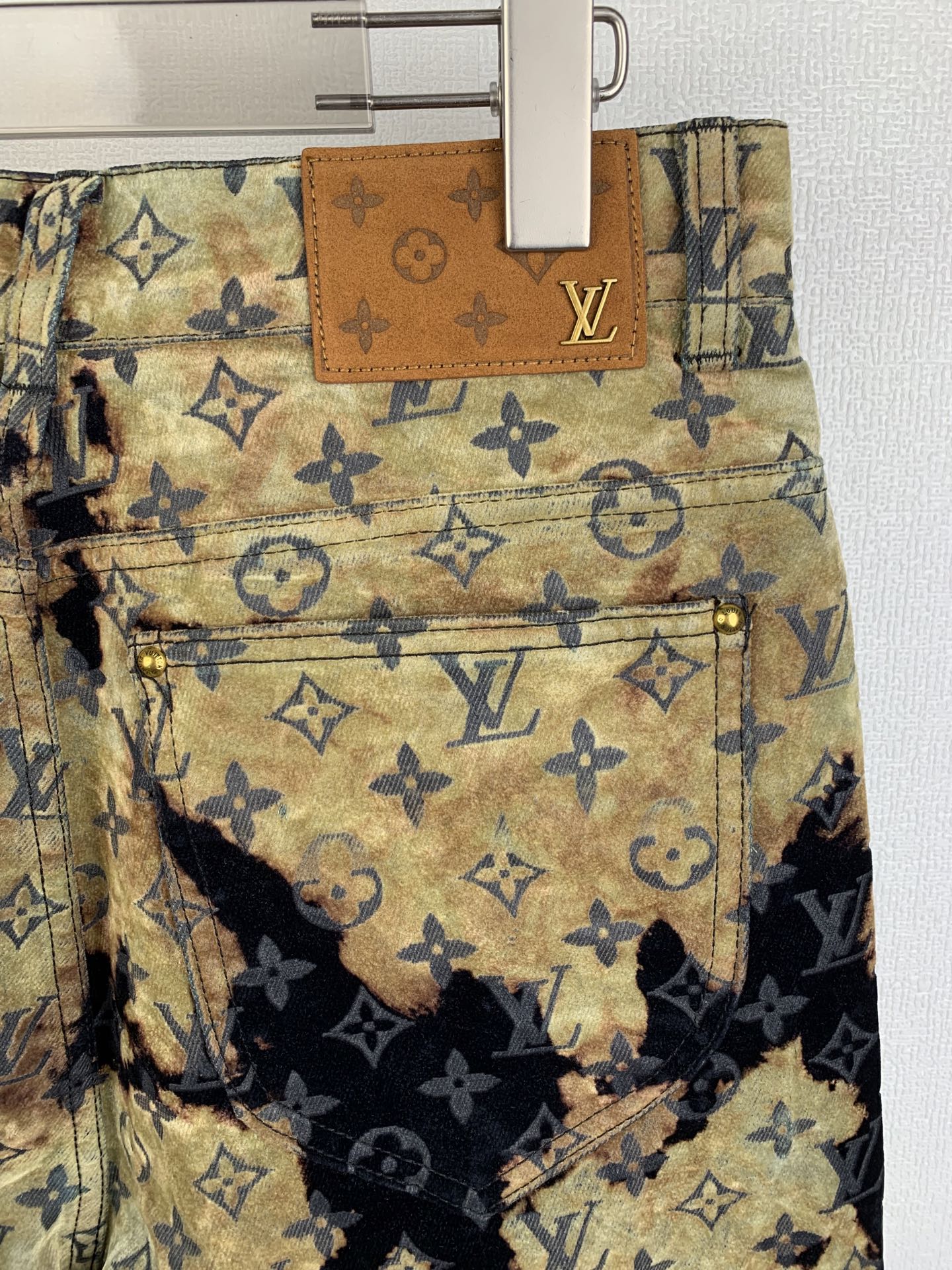 Louis Vuitton monogram jeans with front patch pocket and leather trim