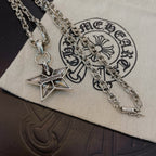 Silver chain necklace with star pendant on white pouch, close-up