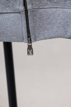 Gray zip-up sweatshirt with LV-logo zipper pull