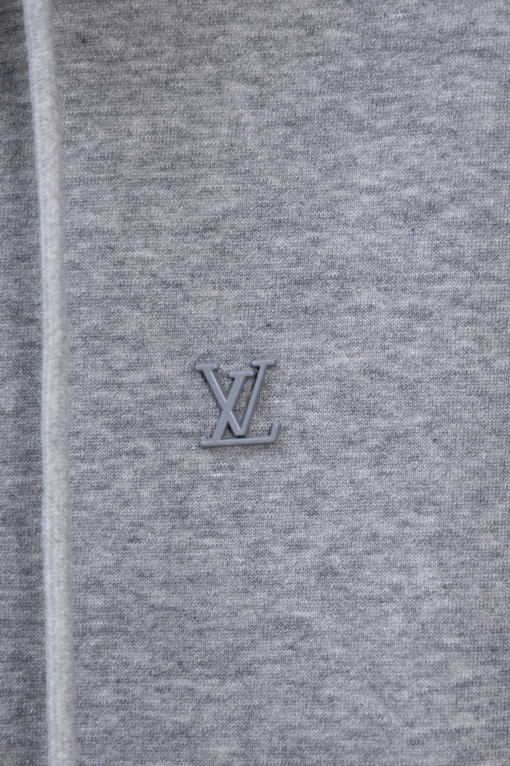 Light gray hoodie with small Louis Vuitton LV logo on the chest.