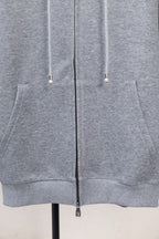 Light gray zip-up hoodie with kangaroo pocket and two drawstring cords.