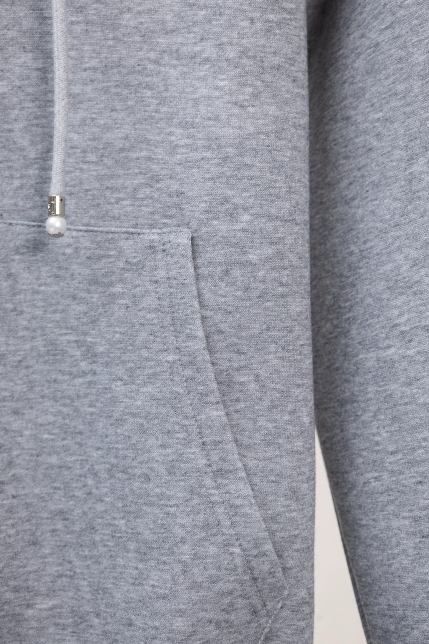 Gray zip-up sweatshirt with drawstring toggle detail