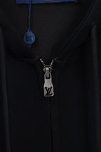 Dark navy hoodie close-up of front zipper and LV logo on metal pull