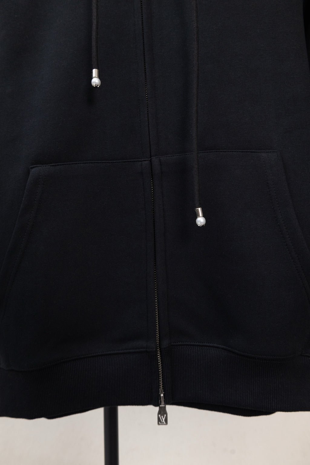 Dark navy hoodie front with kangaroo pocket and zipper down center