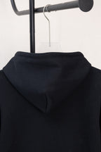 Dark navy hoodie back hood close-up with smooth fabric and folded seam