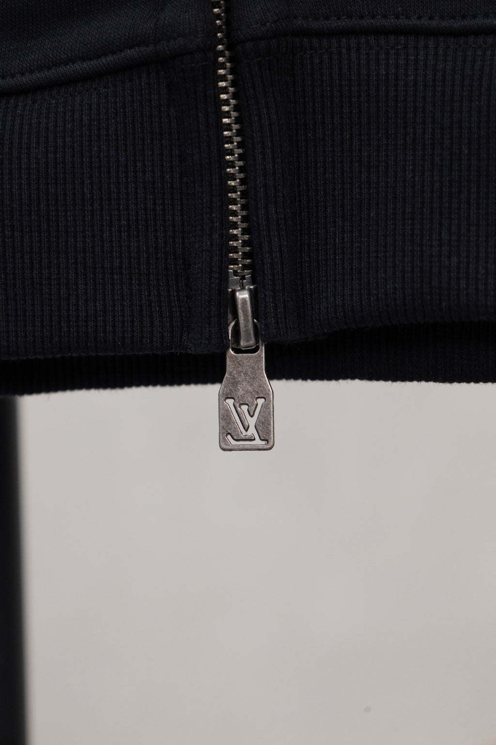 Burberry long zip jacket zipper pull and ribbed hem, dark fabric
