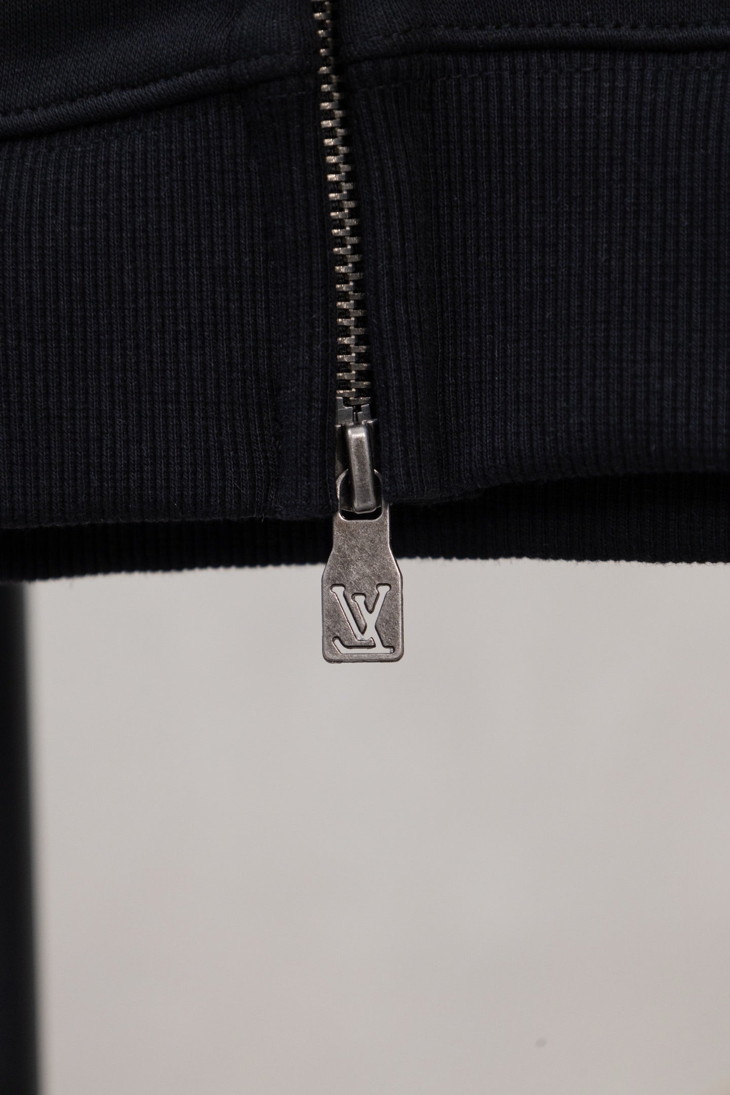Burberry long zip jacket zipper pull and ribbed hem, dark fabric
