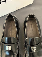 Black leather loafers with silver square logo buckle and stitched edge