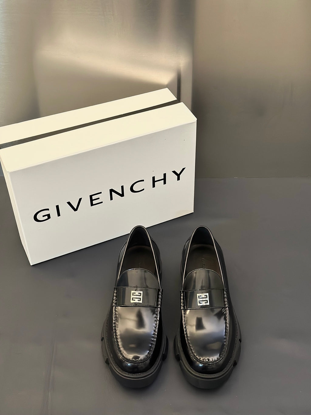 Black leather loafers with square logo buckle, metal detail on vamp