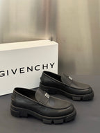 Pair of dark leather loafers with square logo buckle strap, thick platform sole