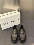 Dark leather loafers with square logo buckle and moc-toe stitching, chunky sole