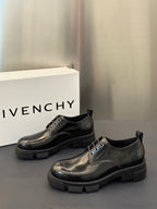 Black leather lace-up derby shoes with chunky sole and lace-up panel