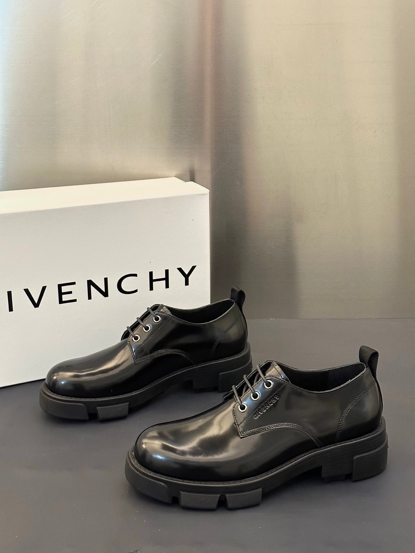 Black leather lace-up derby shoes with chunky sole and lace-up panel