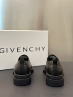 Black leather lace-up shoes with rear pull tabs and cushioned heel collar