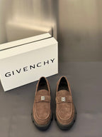 Brown suede loafers with logo plaque strap and thick dark rubber sole
