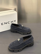 Givenchy suede loafers, dark navy, side profile with metal logo plate and tread sole