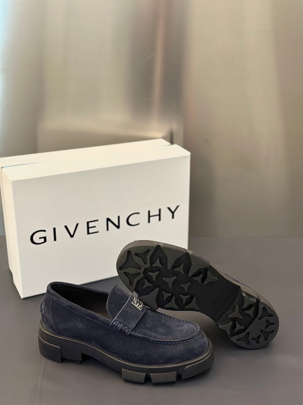 Givenchy suede loafers, dark navy, outsole view shows rugged tread pattern