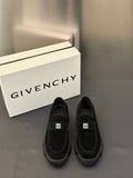 Black suede loafers with square logo buckle and cushioned lug sole, pair view
