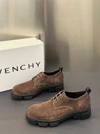 Brown suede lace-up oxford shoes with low heel and chunky dark rubber sole