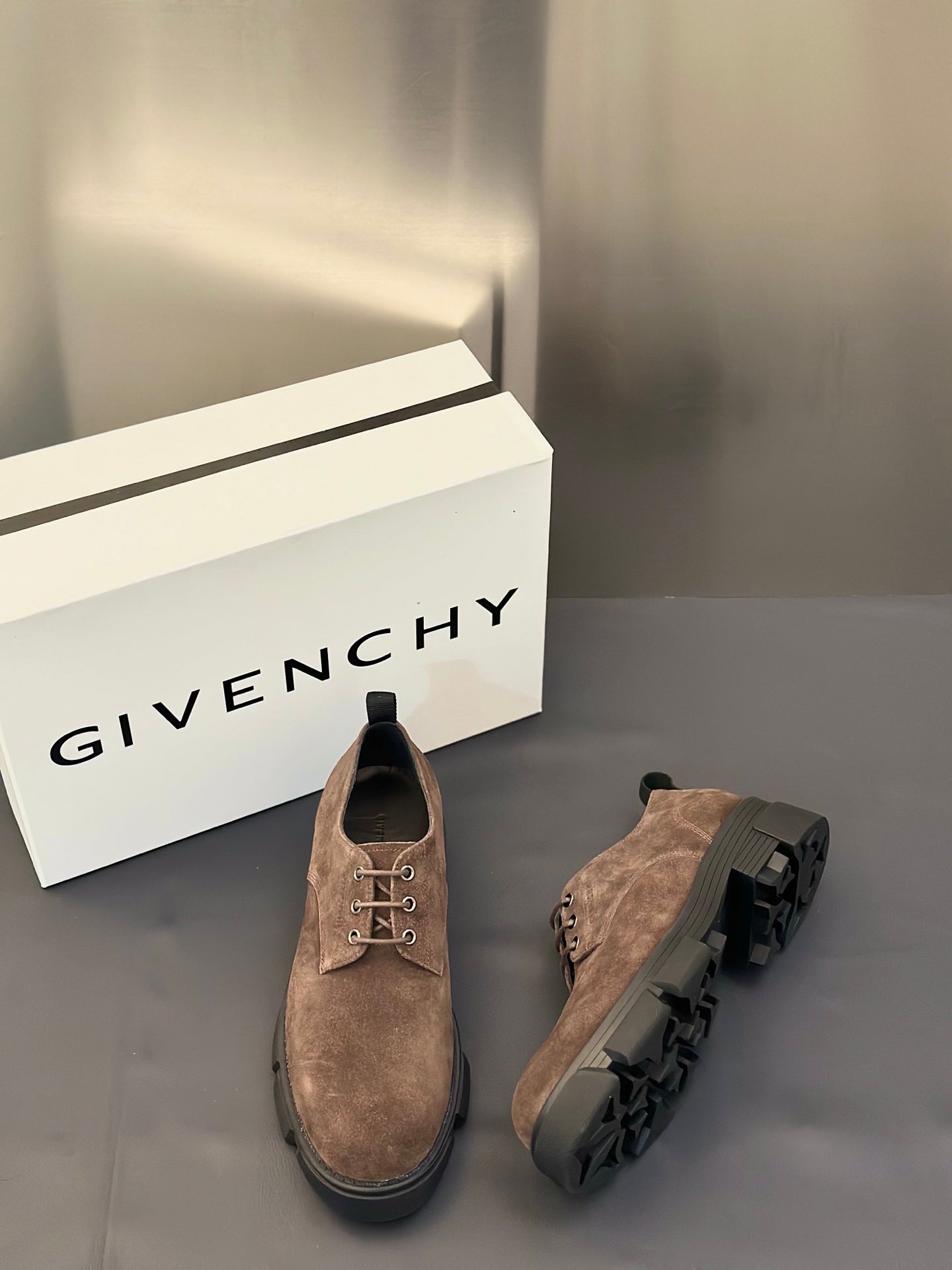 Brown suede lace-up shoes with chunky dark rubber sole and round toe