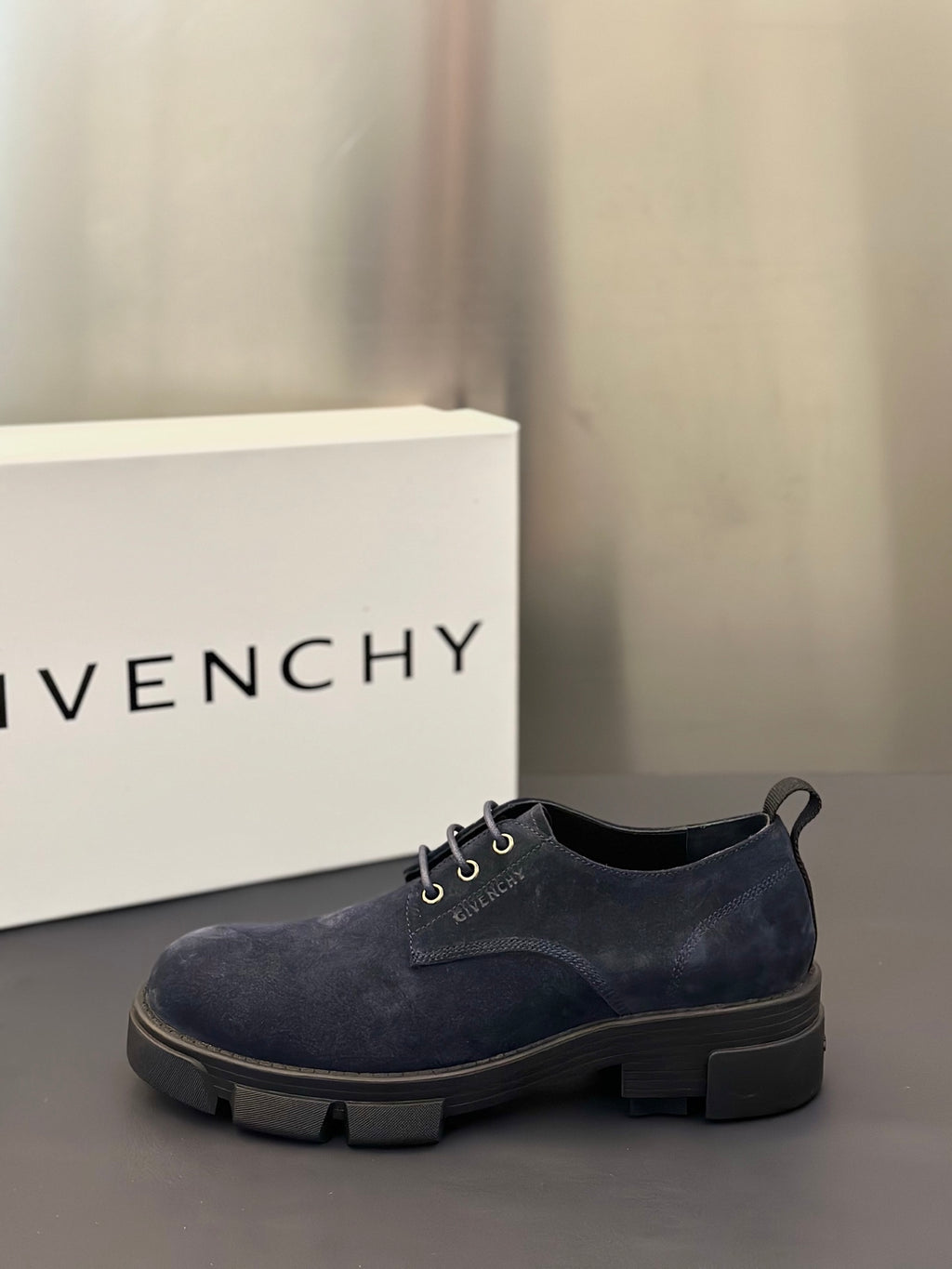 Navy suede lace-up oxford shoes with loop pull tab and rugged sole