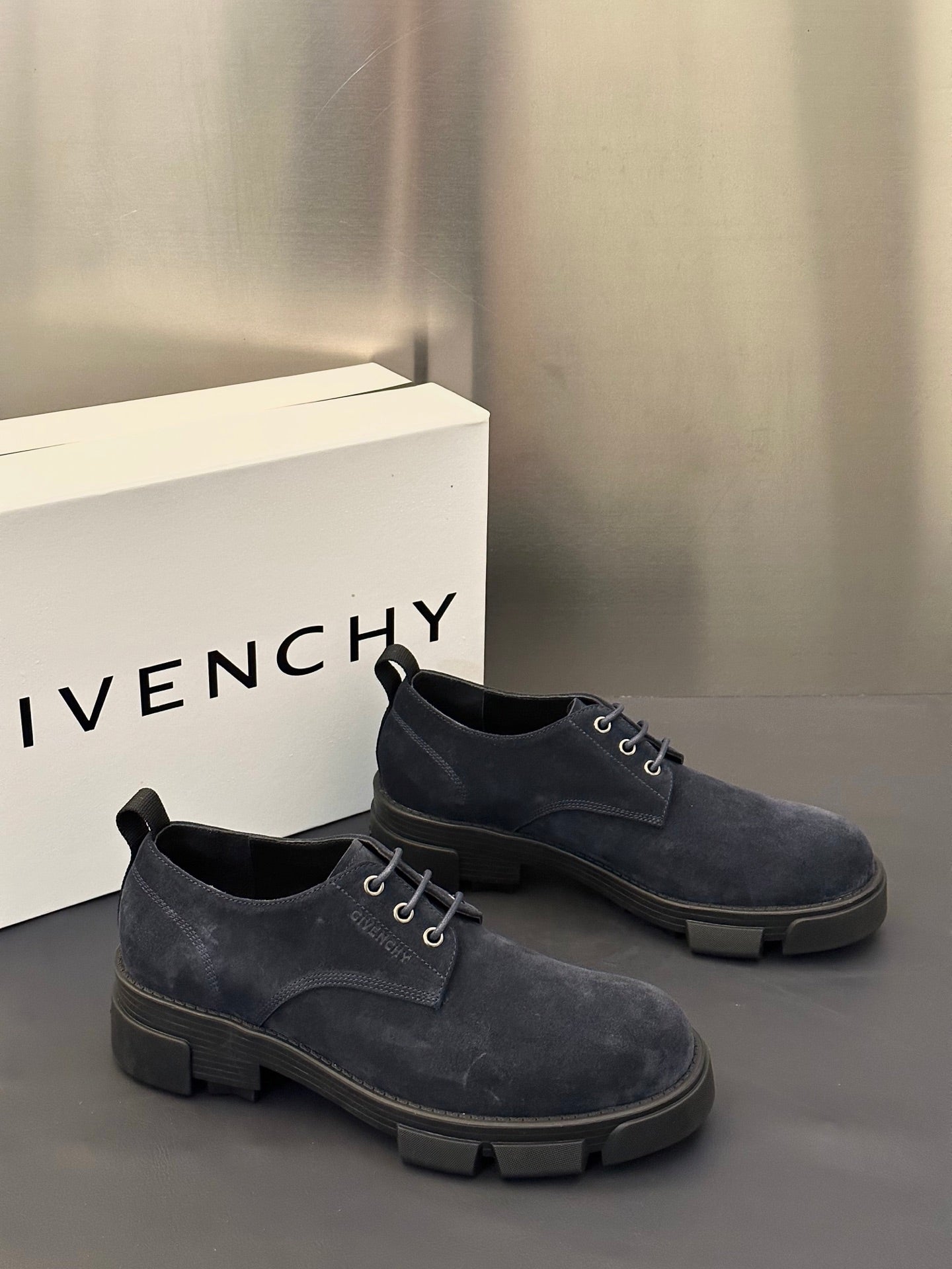 Navy suede lace-up derby shoes with lace-up closure and chunky sole