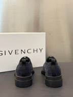 Back view of navy suede lace-up shoes with cushioned heel and rubber sole