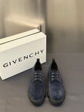 Navy suede lace-up shoes with metal eyelets and thick rubber sole