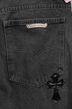 Dark gray denim pocket with heart-shaped stitching and black cross appliqué