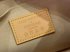Louis Vuitton leather brand label patch with embossed text and stitched border