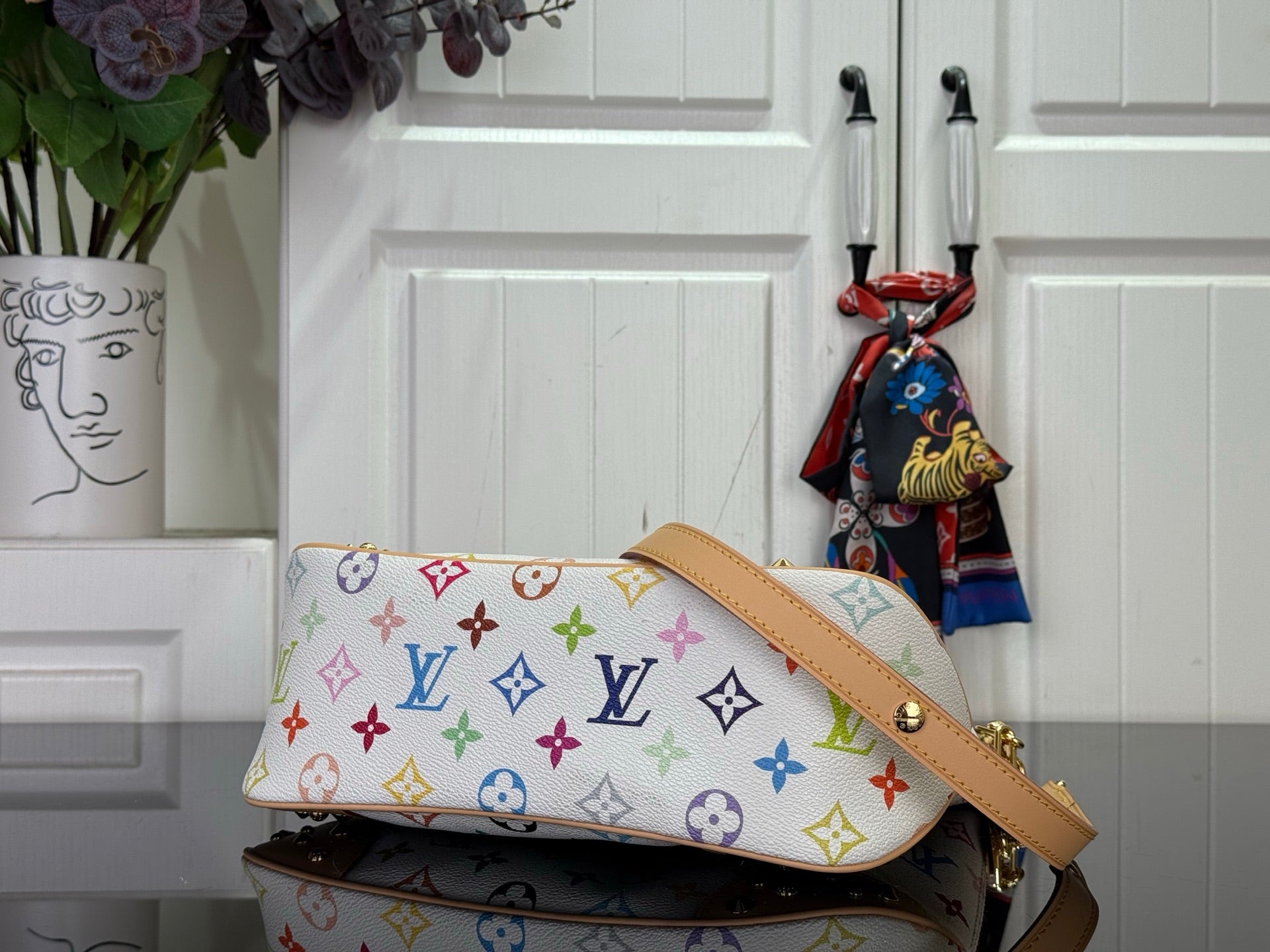 Louis Vuitton multicolor monogram bag with tan strap and gold-tone fittings