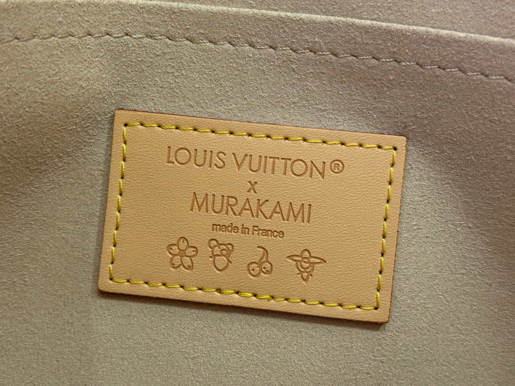 Louis Vuitton Murakami edition bag label, stitched tan leather tag with printed text