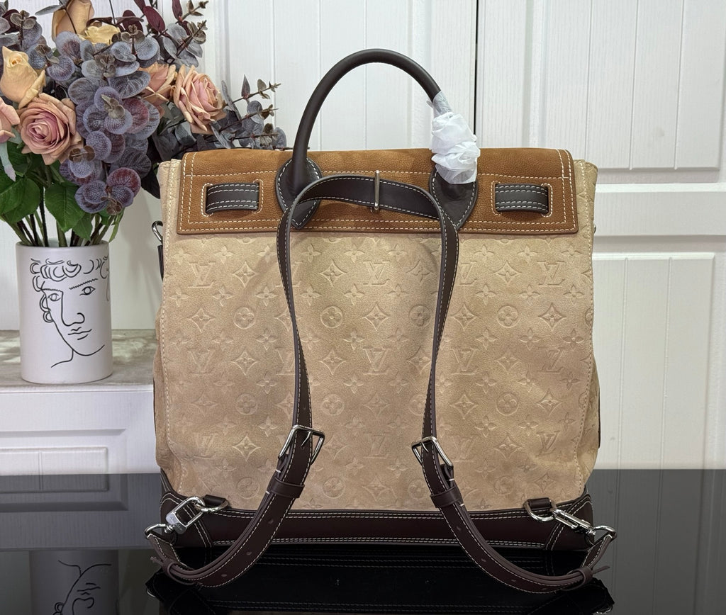 Louis Vuitton monogram tote handbag with top handles and dark leather straps, tan.