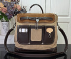Louis Vuitton handbag with dual straps, front pocket, tan with dark brown trim.