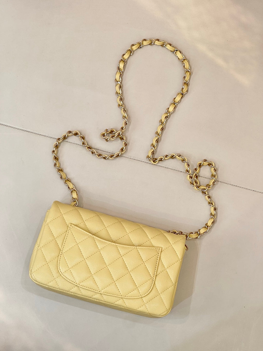 Chanel quilted small shoulder bag with gold chain strap and flap logo clasp