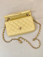 Chanel quilted mini bag with gold chain, flap closure and turn-lock logo