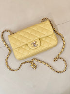 Chanel quilted shoulder bag with gold chain strap, flap and logo emblem