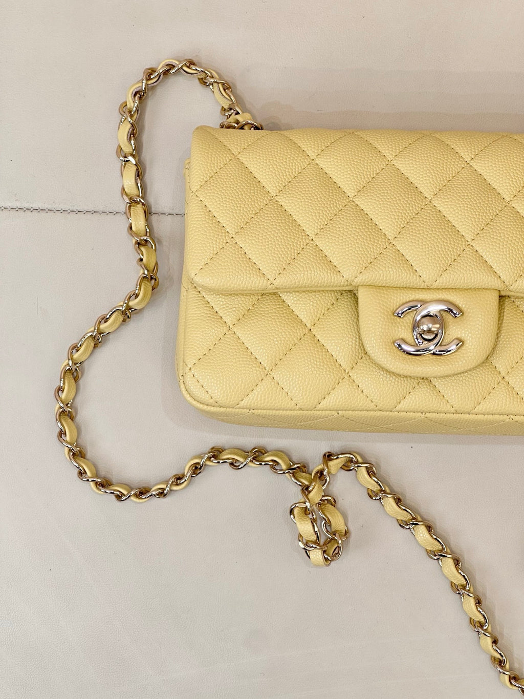 Chanel quilted flap shoulder bag close-up with gold chain strap and logo clasp