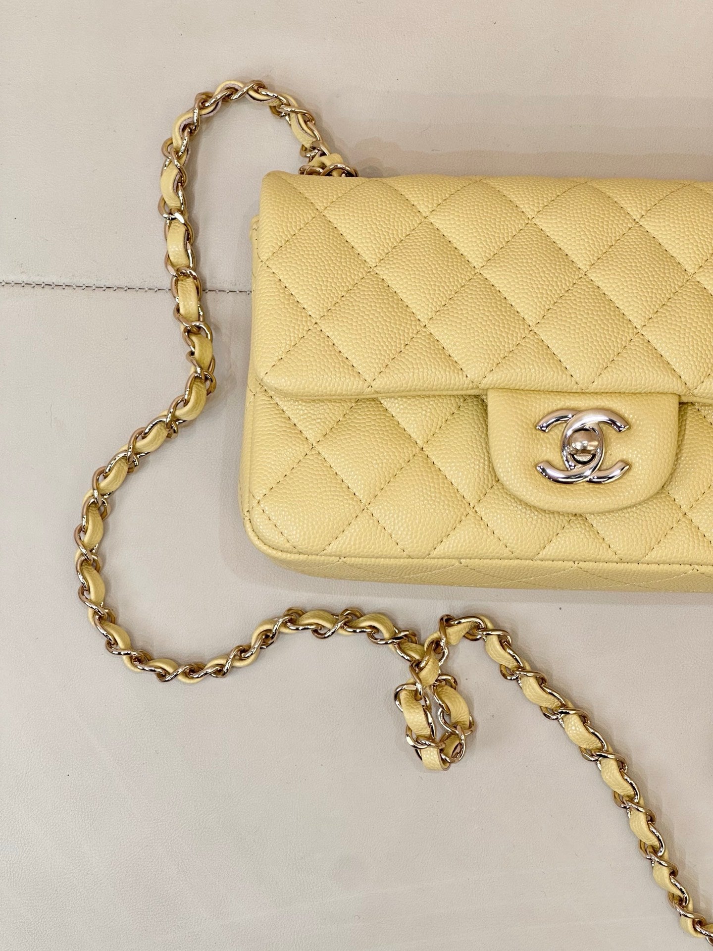 Chanel quilted flap shoulder bag close-up with gold chain strap and logo clasp